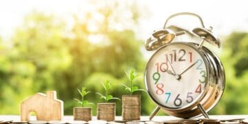 Growing property investments with clock and plant symbols representing market timing.