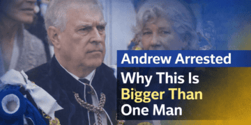 Andrew in ceremonial attire with headlines